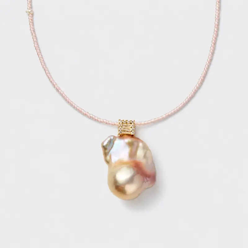 14K gold-filled large baroque pearl beaded necklace with an organic irregular drop shape.