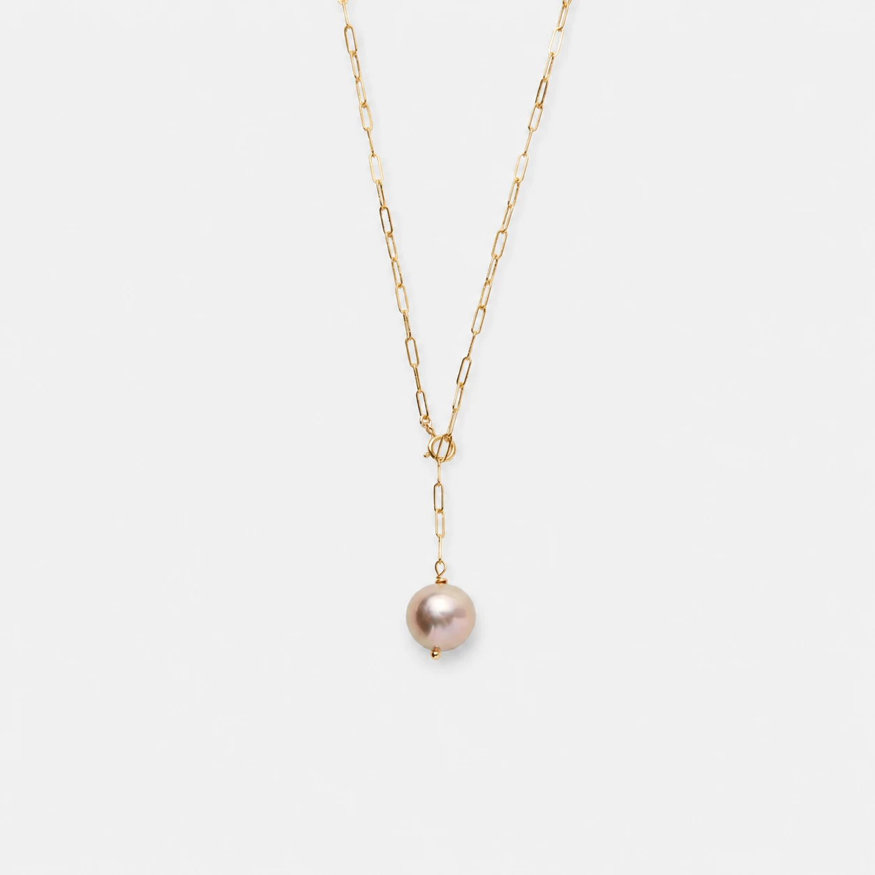 14k-gold-filled-pink-pearl-paperclip-chain-necklace-y-shaped-front-drop 14K gold-filled pink pearl paperclip chain necklace with a Y-shaped front drop design.