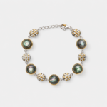 18K gold plated sterling silver abalone shell link bracelet with round ocean-toned inlays and woven silver-gold textured discs.