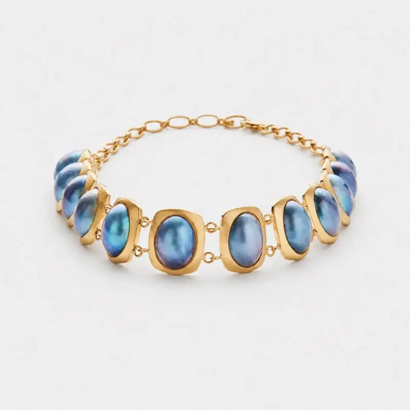 18K gold plated sterling silver blue mabe pearl necklace in a rhythmic oval collar layout