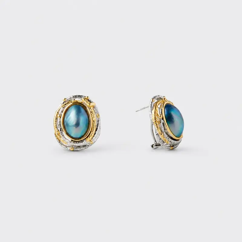 18K gold plated sterling silver blue mabe pearl stud earrings in a sculpted dimensional oval frame