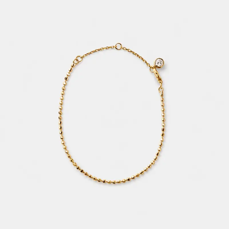 18k gold plated sterling silver cubic zirconia chain bracelet in a minimalist fine bead silhouette