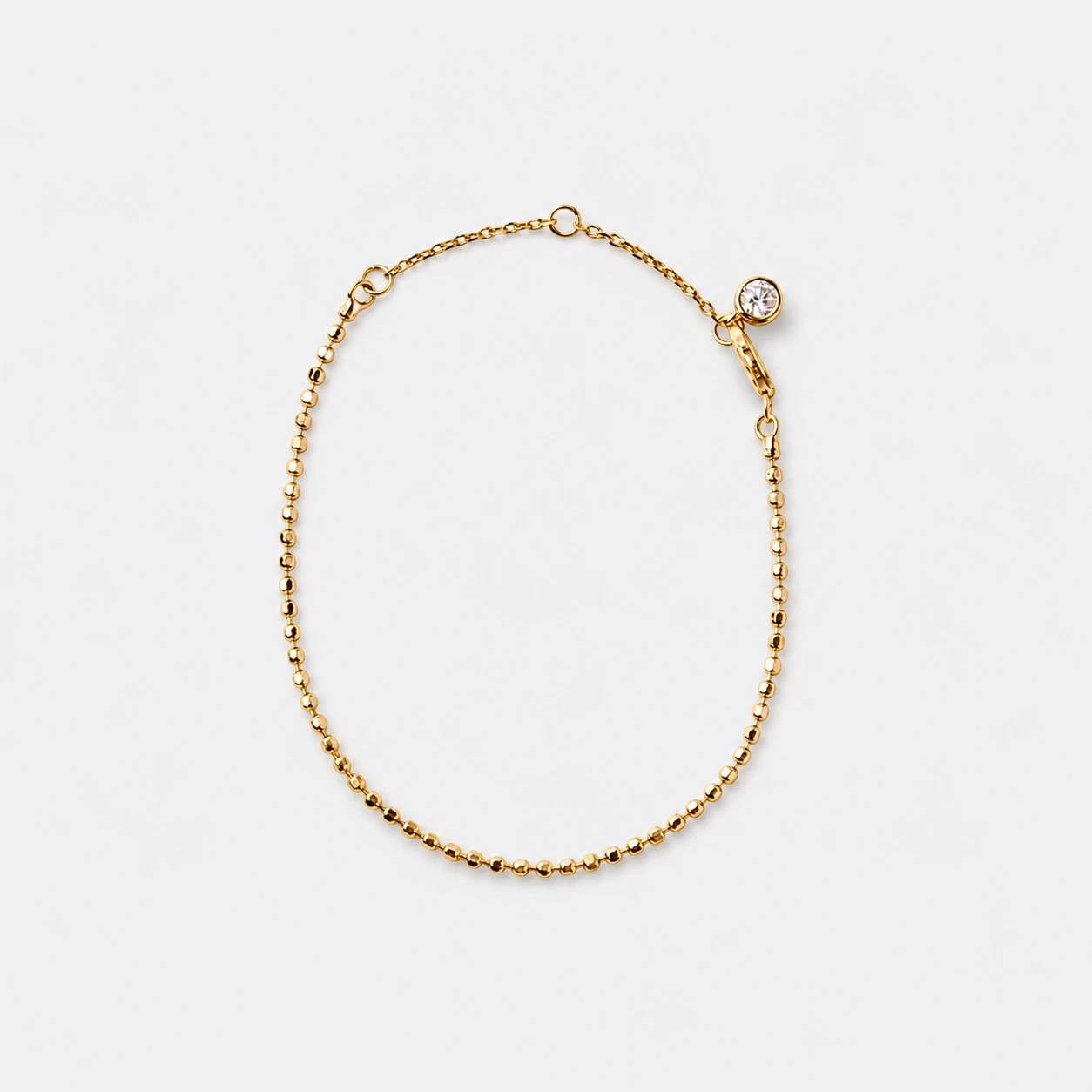 18k-gold-plated-sterling-silver-cubic-zirconia-bead-chain-bracelet 18k gold plated sterling silver cubic zirconia chain bracelet in a minimalist fine bead silhouette