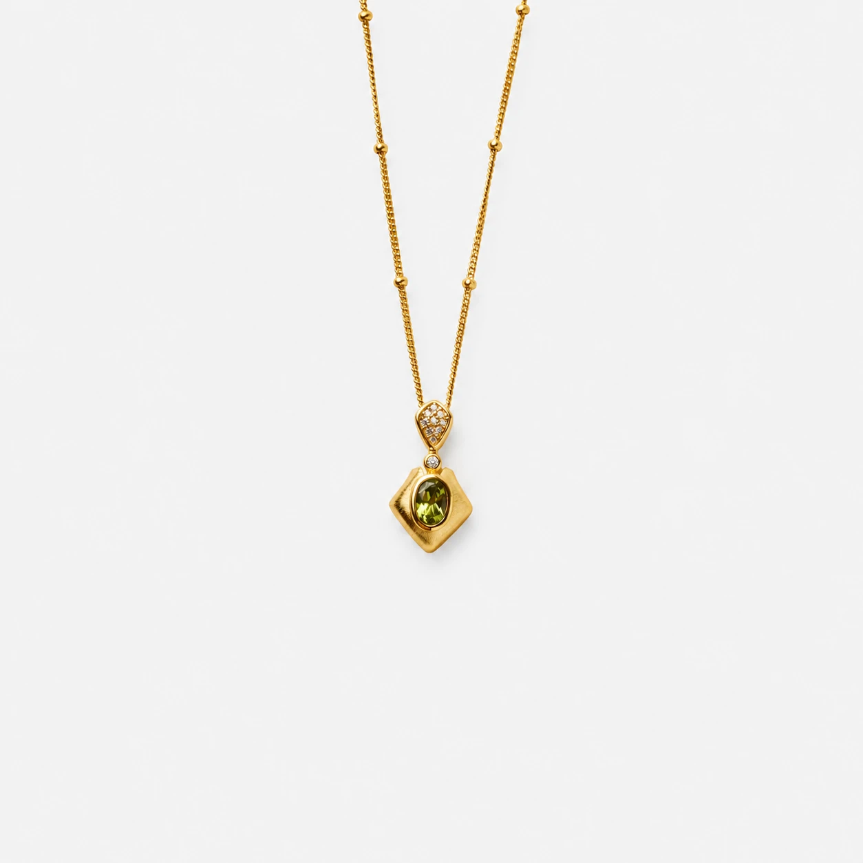 18k-gold-plated-sterling-silver-green-peridot-pendant-necklace-minimalist-diamond-shape 18K gold plated sterling silver green peridot pendant necklace in a minimalist diamond shape silhouette