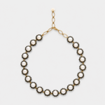 18K gold plated sterling silver necklace featuring round white pearls surrounded by graphic black spinel halos.