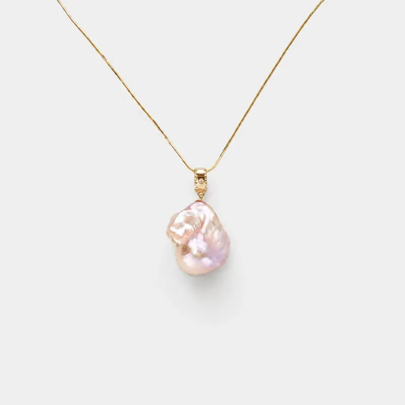 18K gold plated sterling silver pink baroque pearl necklace in a minimalist organic drop design