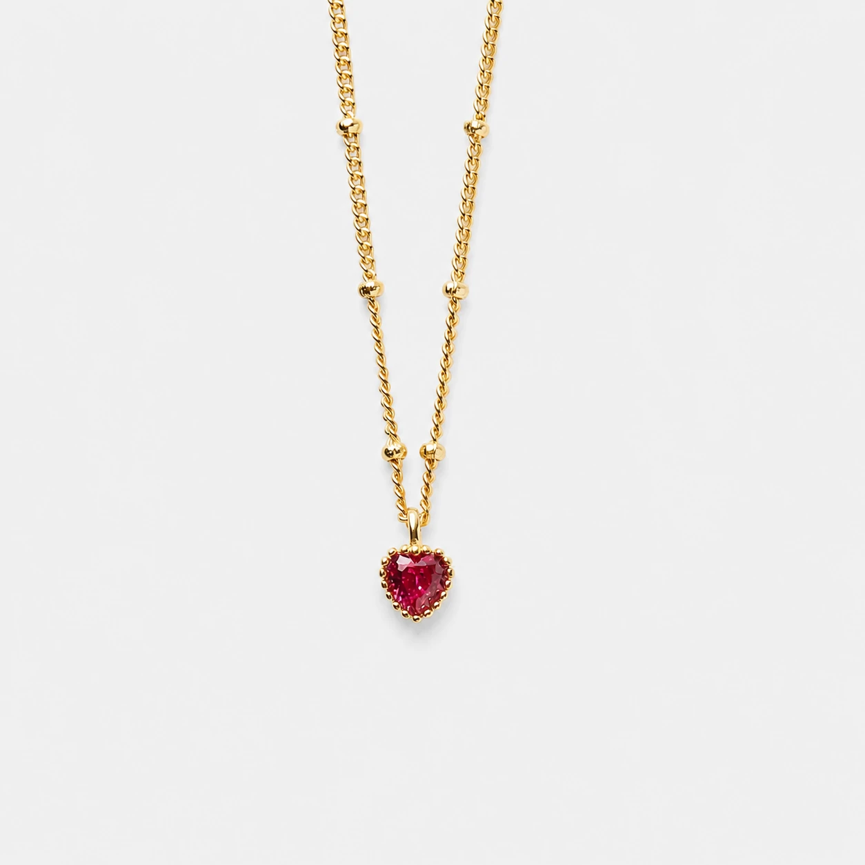 18k-gold-plated-sterling-silver-red-cubic-zirconia-necklace-romantic-heart-shaped 18K gold plated sterling silver red cubic zirconia necklace in a romantic heart-shaped design.
