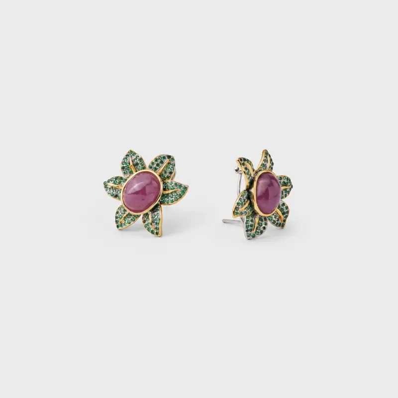 18K gold plated sterling silver ruby stud earrings featuring a floral shape with green pavé accents.