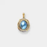 18K gold plated sterling silver two-tone blue mabe pearl pendant in a raised oval setting with a detailed bail