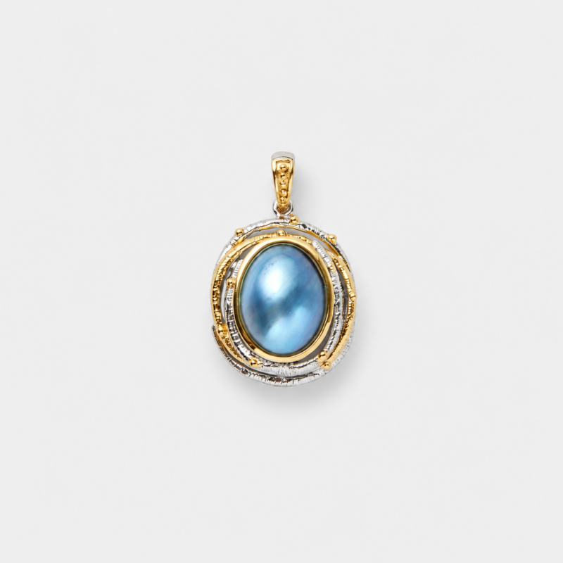 18K gold plated sterling silver two-tone blue mabe pearl pendant in a raised oval setting with a detailed bail