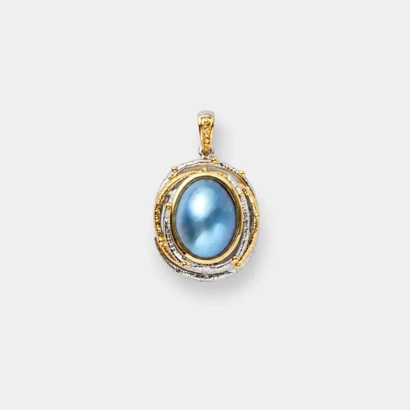 18K gold plated sterling silver two-tone blue mabe pearl pendant in a raised oval setting with a detailed bail