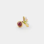 18K gold plated two-tone sterling silver ruby ring featuring a rounded cabochon center and an artistic flower-like peridot side structure.