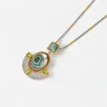 ONDA LENTA Abalone Shell Pendant with iridescent abalone shell, peridot accents, and a two-tone chain.