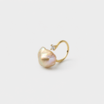 Close-up angled view highlighting the sparkling cubic zirconia accent on the open curved band ring crafted in 18K gold plated sterling silver