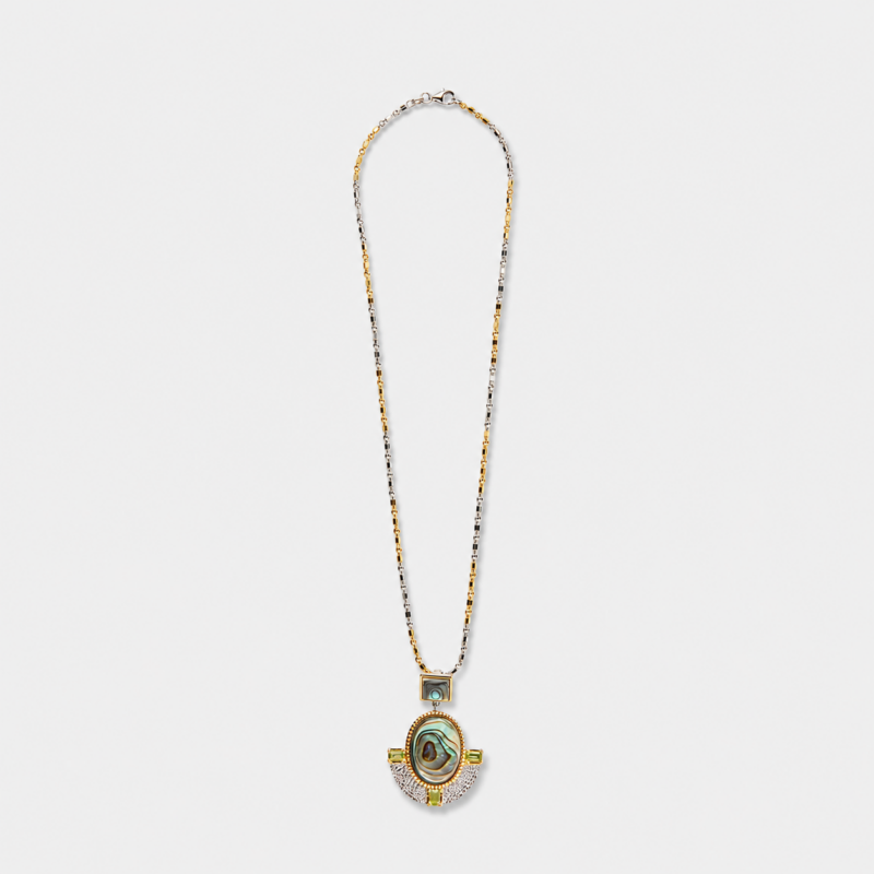 Close-up angled view highlighting the textured silver fan motif and shimmering iridescence of the abalone shell pendant with two-tone 18K gold plating