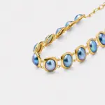 18K gold plated sterling silver blue mabe pearl necklace in a rhythmic oval collar layout
