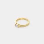 Close-up detail view of the low-profile rectangular zircon and softly textured band on this minimal ring crafted in 18K gold plated sterling silver