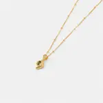 Close-up detail view focusing on the prong-set faceted green peridot stone within the diamond-shaped pendant on an 18K gold plated sterling silver chain