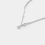 Close-up detail view of the shimmering silver-white zircon charm and fine bead links on this delicate chain bracelet crafted in rhodium plated sterling silver