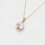 Close-up view showing the organic texture and soft luster of the pink baroque pearl pendant necklace with 18K gold plated silver hardware