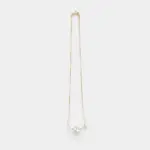 An elegant and polished 14K Gold Vermeil necklace with a singular, lustrous white pearl and a tiny sparkling cubic zirconia charm, perfect for achieving a refined, everyday look.