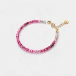 Close-up view of an ONDA LENTA bracelet with faceted pink tourmaline beads in naturally varied pink and pale tones.