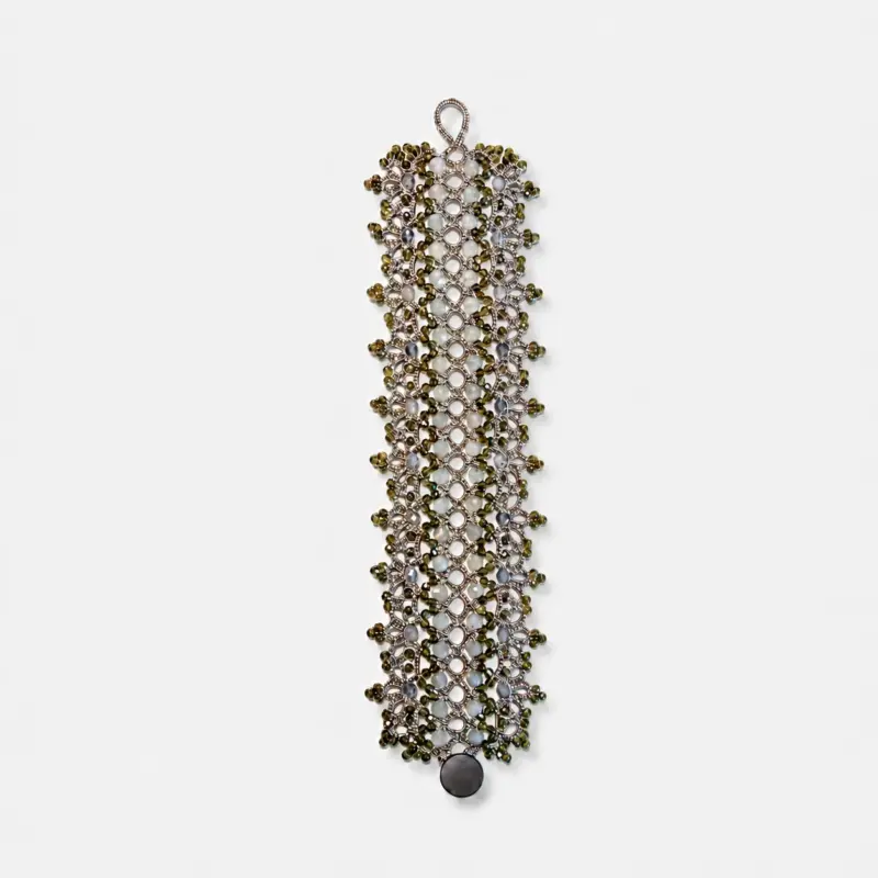 Lace-woven textile bracelet featuring flash stone, iolite, and golden obsidian beads in a wide bohemian openwork geometric shape.
