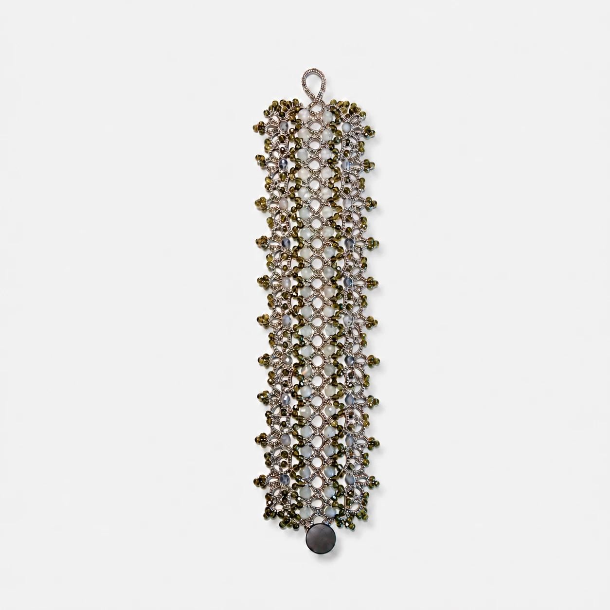 lace-woven-flash-stone-iolite-golden-obsidian-bracelet-wide-boho-shape Lace-woven textile bracelet featuring flash stone, iolite, and golden obsidian beads in a wide bohemian openwork geometric shape.