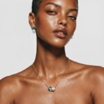 Model wearing Abalone Shell Pearl Necklace centered cleanly at her neckline for a polished everyday jewelry look.