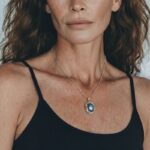 Model wearing Blue Mabe Pearl Pendant with a calm ocean-like glow around her neckline for an elegant workwear style