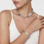 Model wearing Peruvian Blue Opal Baroque Pearl Necklace casually at the collarbone.