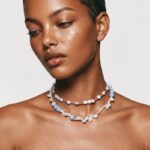 etailed close-up view of organic petal baroque pearls linked meticulously with clean 925 sterling silver chain links