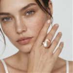 Model wearing Pink Baroque Pearl Diamond Ring with a fluid open band on her finger for creative workwear styling