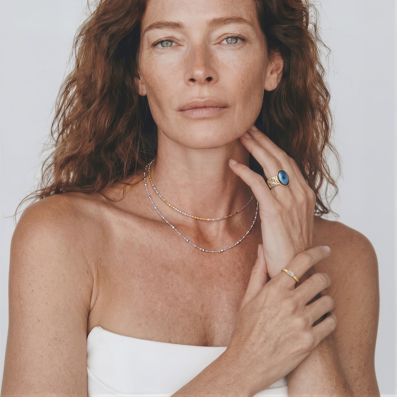 Model wearing Two-Tone Necklace layered elegantly on her neck for everyday workwear and travel styling.