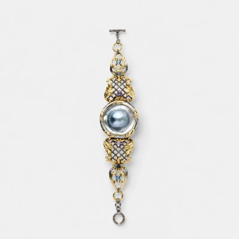 ONDA LENTA Sun Shell Amethyst Topaz Bracelet with an iridescent shell centerpiece, purple and blue gemstones, and ornate two-tone metalwork.