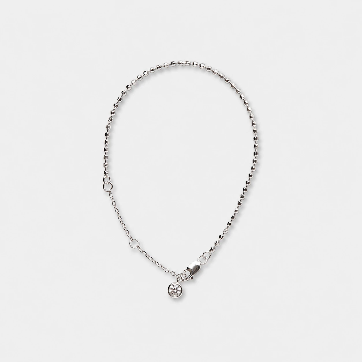 rhodium-plated-925-sterling-silver-cubic-zirconia-chain-bracelet-minimalist-bead Rhodium plated 925 sterling silver cubic zirconia chain bracelet in a minimalist fine bead silhouette