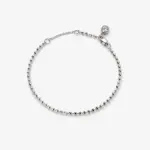 ONDA LENTA silver beaded chain bracelet with a clear round stone charm, lobster clasp and adjustable extension chain.
