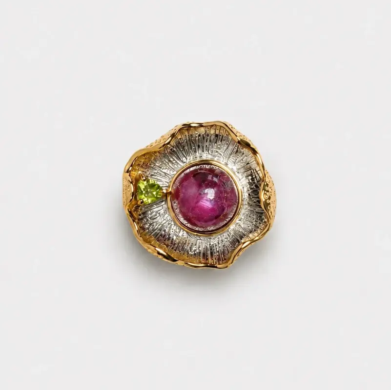 18k gold plated sterling silver pendant featuring a bold ruby cabochon and fresh peridot in a radiating floral shell design.