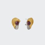 18K gold plated sterling silver textured mixed-metal stud earrings featuring a round red ruby cabochon in an organic sculptural curved shape.