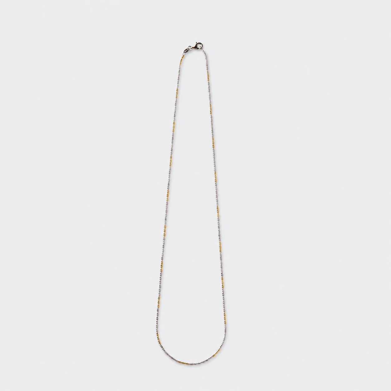two-tone-chain-necklace-ondalenta Two-Tone Chain Necklace with alternating gold and silver-tone links by ONDA LENTA