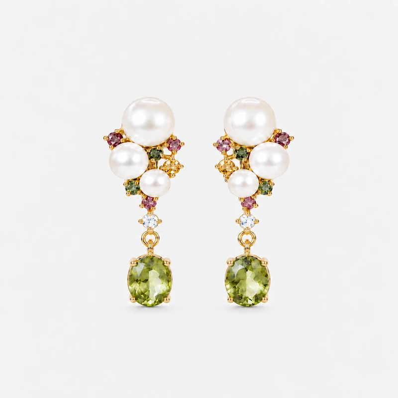 Front view of ONDA LENTA pearl drop earrings featuring oval green gemstones, white pearls and colorful gemstone accents.